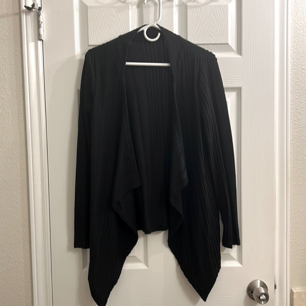 Thin black cardigan. No button/zip- no pockets